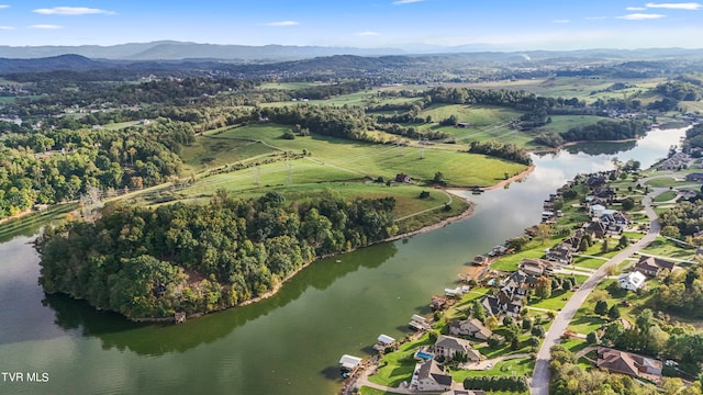 aerial view featuring a water and mountain view