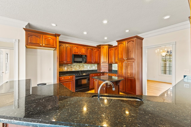 kitchen featuring a textured ceiling, crown molding, sink, and black appliances