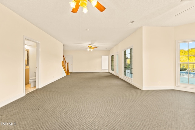 carpeted empty room with ceiling fan