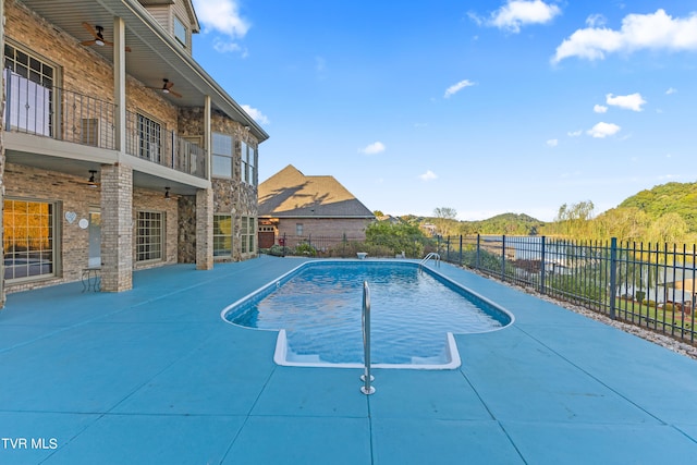 view of swimming pool featuring a patio