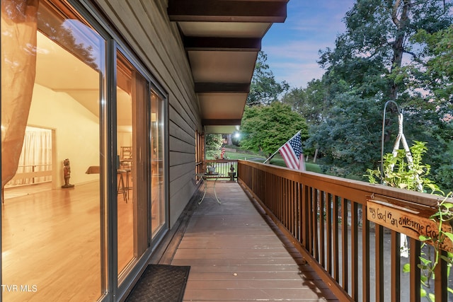 view of balcony at dusk