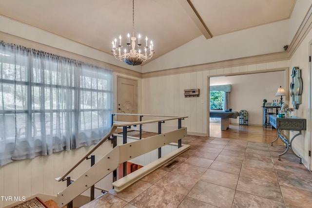 dining space featuring vaulted ceiling with beams and a chandelier