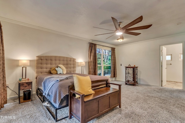 bedroom featuring ceiling fan, light colored carpet, crown molding, and ensuite bath