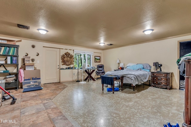 bedroom featuring a textured ceiling