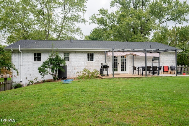 back of house with a patio, a pergola, and a yard