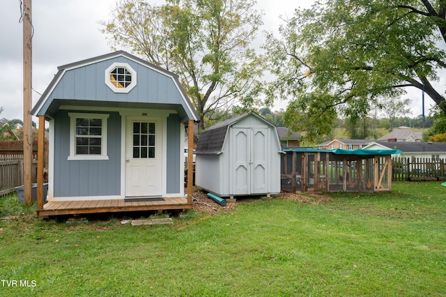 view of outdoor structure with a pool and a yard