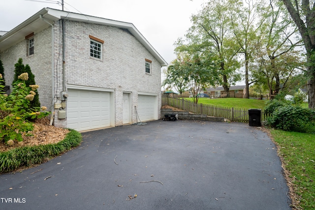 view of side of property featuring a garage