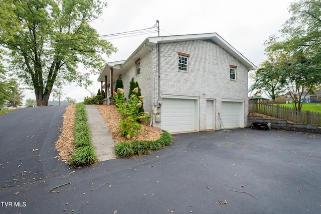 view of side of property featuring a garage