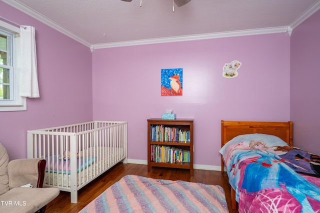 bedroom with ornamental molding, dark hardwood / wood-style floors, and ceiling fan