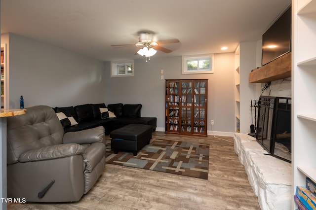 living room with hardwood / wood-style floors and ceiling fan