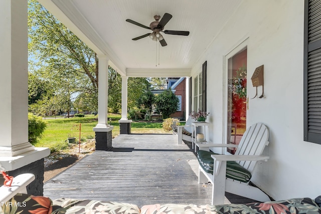 wooden deck with ceiling fan and a porch