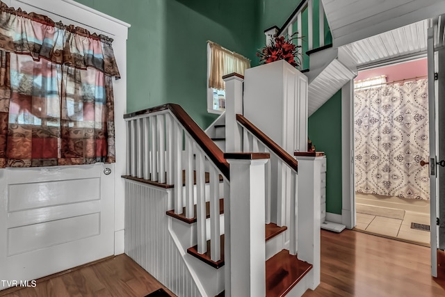 stairway with wood-type flooring