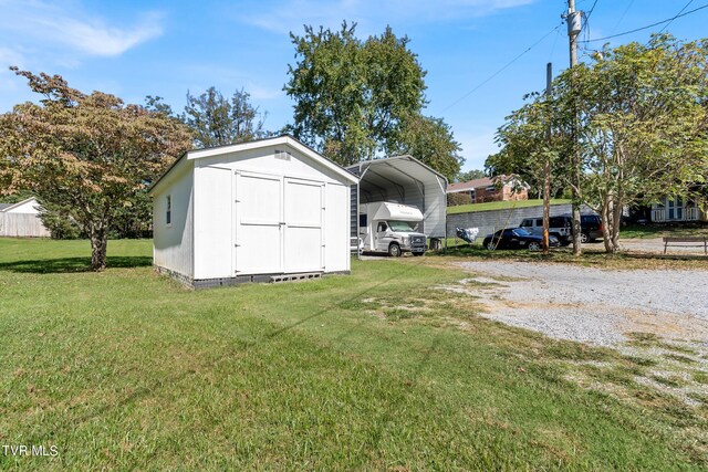 view of outdoor structure featuring a lawn and a carport