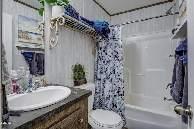 bathroom with crown molding, a textured ceiling, toilet, and vanity