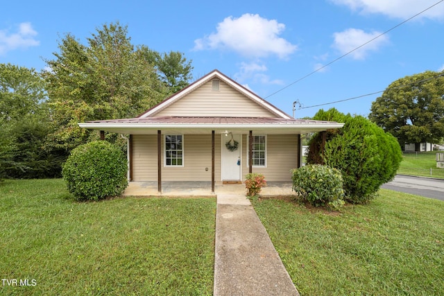 view of front of house featuring a front yard and a porch