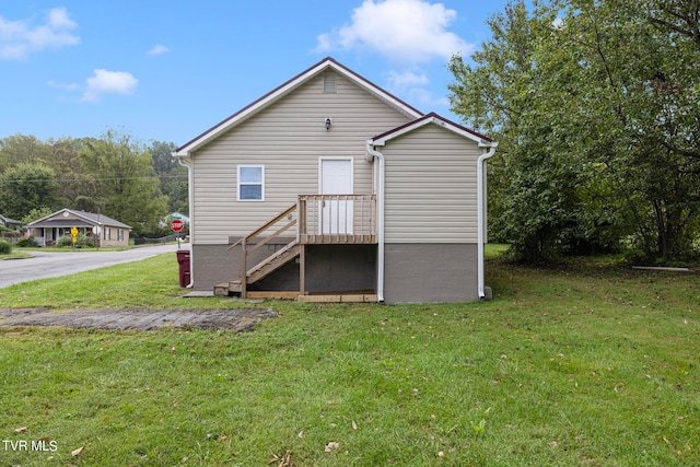 rear view of house with a yard