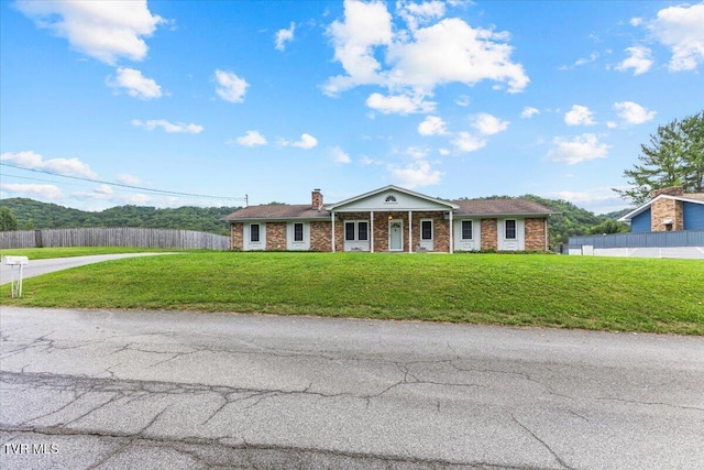 view of front of home with a front yard