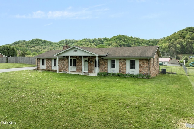 300 Wimberly Way, Bristol, TN 37620 - ranch-style home with covered porch, fence, a shingled roof, and a front yard
