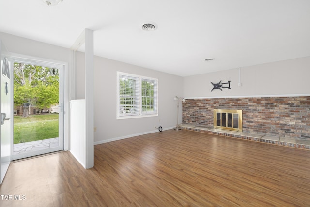 300 Wimberly Way, Bristol, TN 37620 - unfurnished living room featuring a fireplace, visible vents, wood finished floors, and baseboards