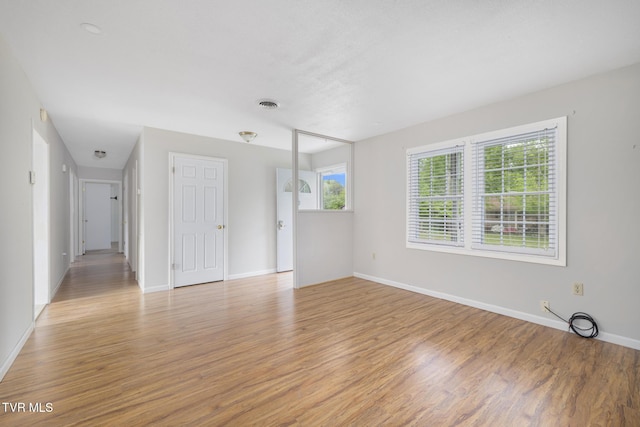 300 Wimberly Way, Bristol, TN 37620 - unfurnished living room featuring baseboards, light wood-type flooring, and visible vents