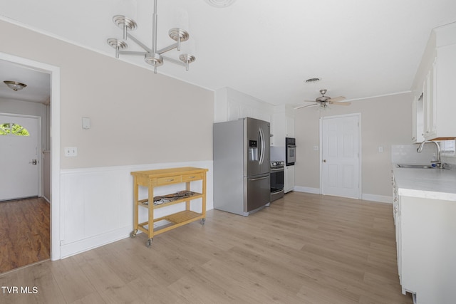 300 Wimberly Way, Bristol, TN 37620 - kitchen with white cabinetry, light countertops, stainless steel fridge, and a sink
