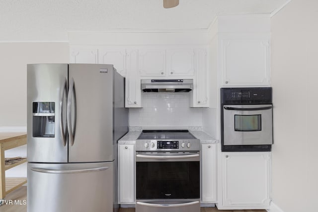 300 Wimberly Way, Bristol, TN 37620 - kitchen with white cabinetry, tasteful backsplash, stainless steel appliances, light countertops, and under cabinet range hood