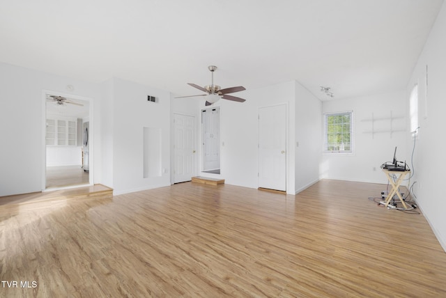 300 Wimberly Way, Bristol, TN 37620 - unfurnished living room with baseboards, a ceiling fan, and light wood-style flooring