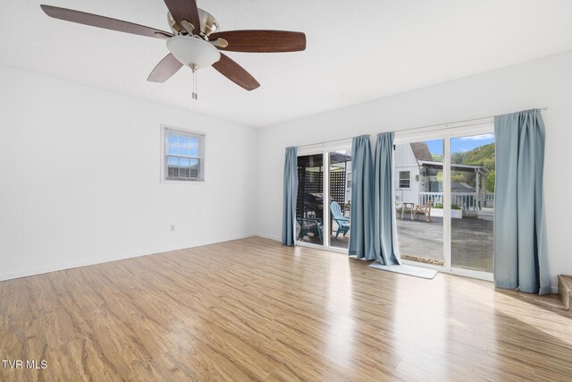 300 Wimberly Way, Bristol, TN 37620 - empty room with wood finished floors, plenty of natural light, and a ceiling fan