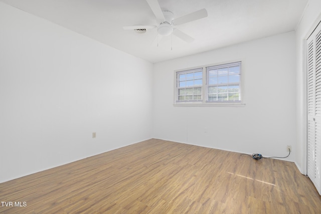 300 Wimberly Way, Bristol, TN 37620 - unfurnished bedroom featuring wood finished floors, a ceiling fan, and a closet