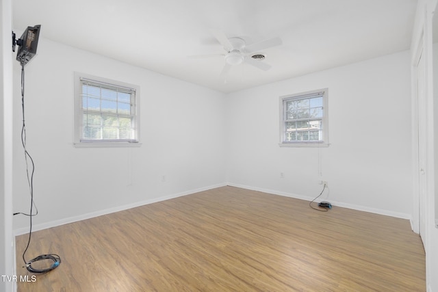 300 Wimberly Way, Bristol, TN 37620 - empty room with light wood finished floors, ceiling fan, baseboards, and plenty of natural light