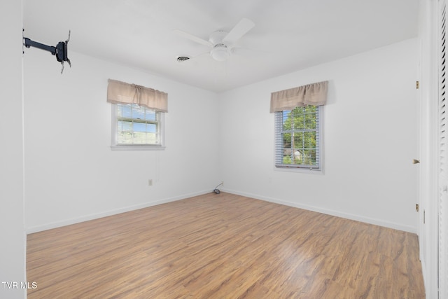300 Wimberly Way, Bristol, TN 37620 - unfurnished bedroom with baseboards, wood finished floors, and multiple windows