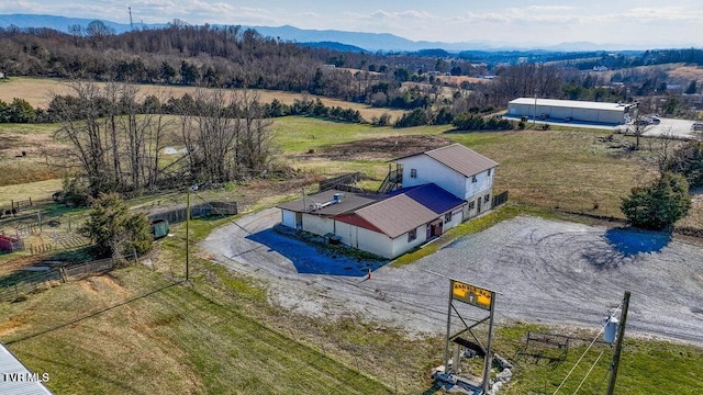 drone / aerial view with a rural view and a mountain view