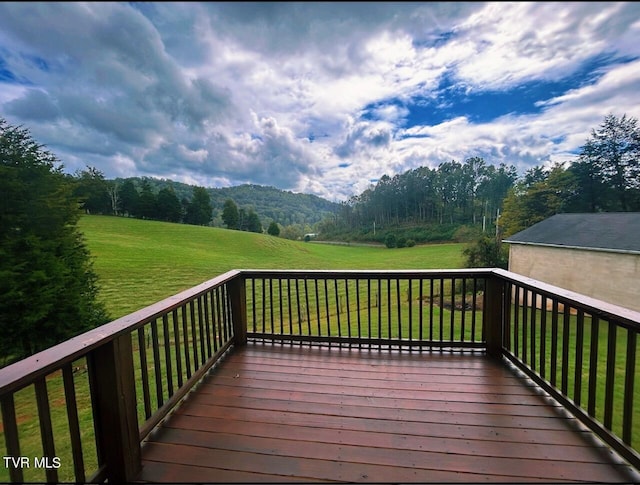 wooden terrace with a yard