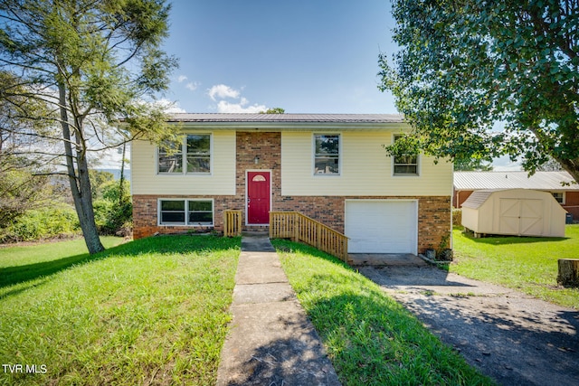 raised ranch with a storage shed, a front lawn, and a garage