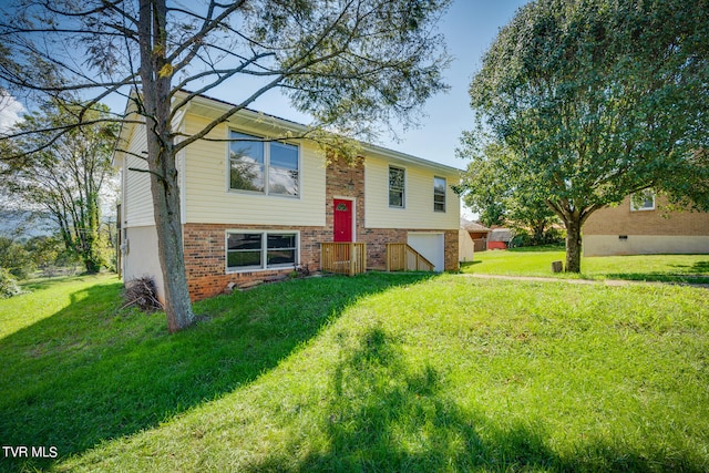 bi-level home with a front lawn