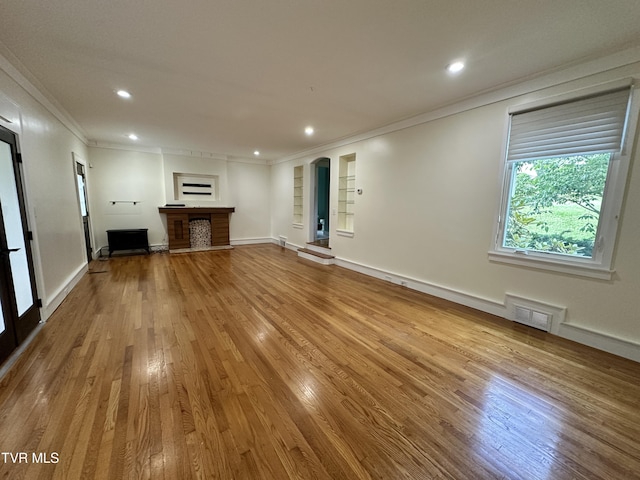 1357 Watauga St, Kingsport, TN 37660 - unfurnished living room with crown molding, wood finished floors, recessed lighting, and built in features