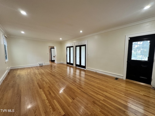 1357 Watauga St, Kingsport, TN 37660 - unfurnished living room with ornamental molding, recessed lighting, and light wood-style floors