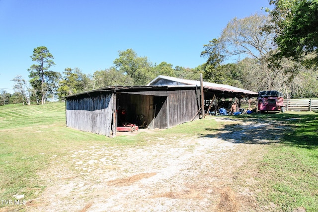 view of outbuilding featuring a yard