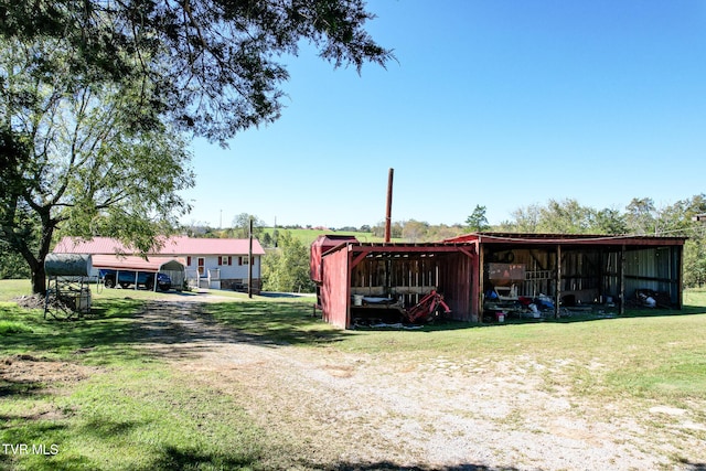 view of outbuilding with a lawn