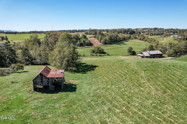 birds eye view of property with a rural view