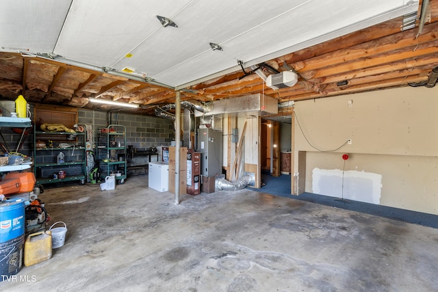 garage featuring a garage door opener and heating unit