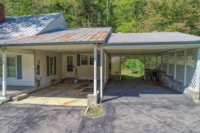 view of parking / parking lot with a carport