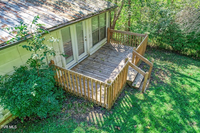 deck featuring a lawn