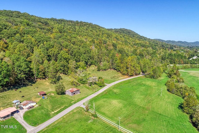 birds eye view of property featuring a rural view