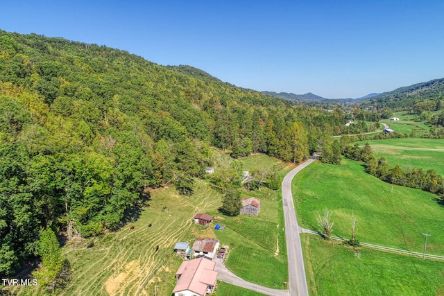 drone / aerial view featuring a mountain view and a rural view