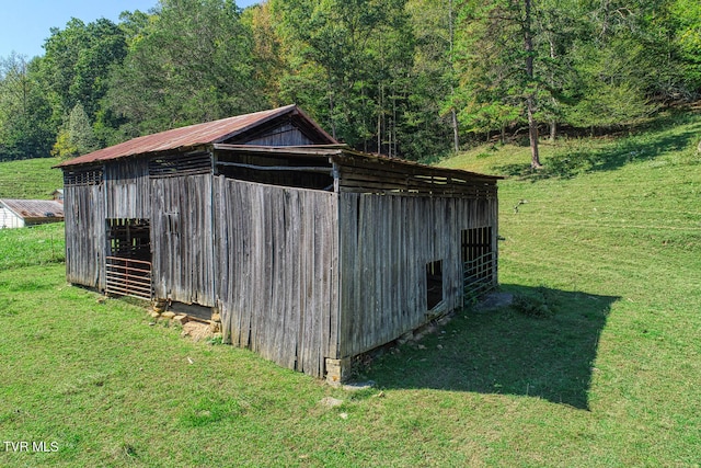 view of outdoor structure with a lawn