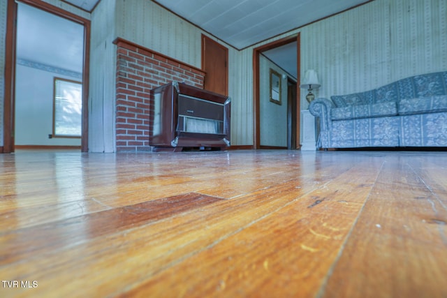 unfurnished living room with hardwood / wood-style flooring and vaulted ceiling