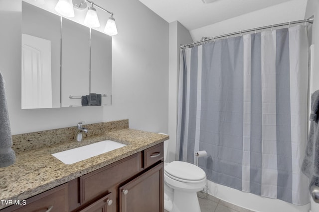 full bath with shower / tub combo, tile patterned flooring, vanity, and toilet