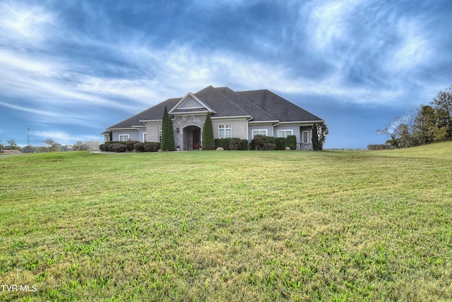 single story home with a front yard