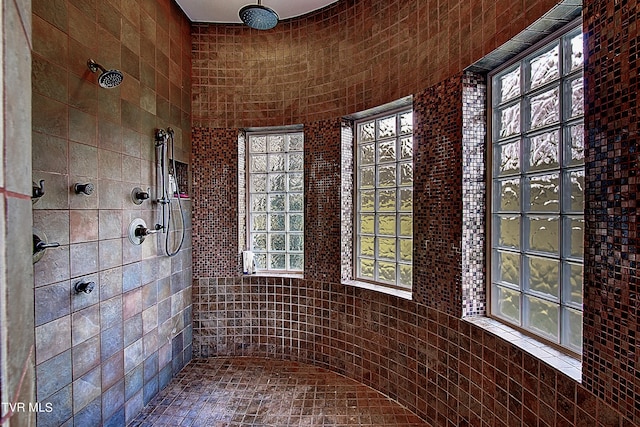 bathroom with tiled shower